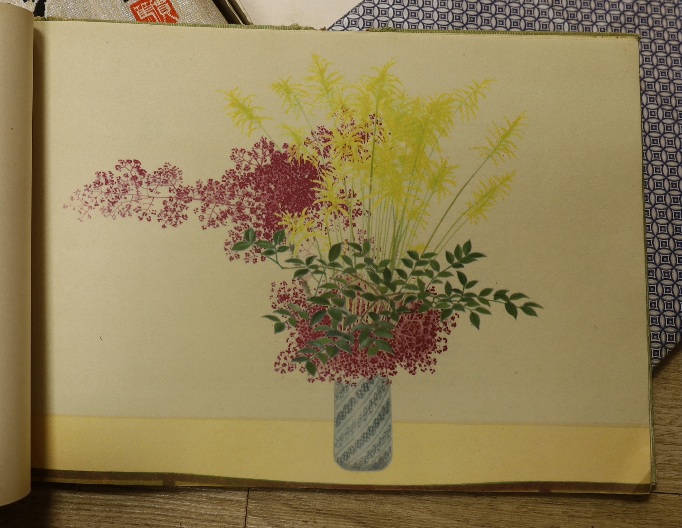 A Chinese album of flower prints Wu Changshuo, published by Cao Bai, 1972, a book of Modern Japanese Art of Flower Arrangements, a fine silk commemorative handkerchief with a printed panel depicting the surrender in 1905